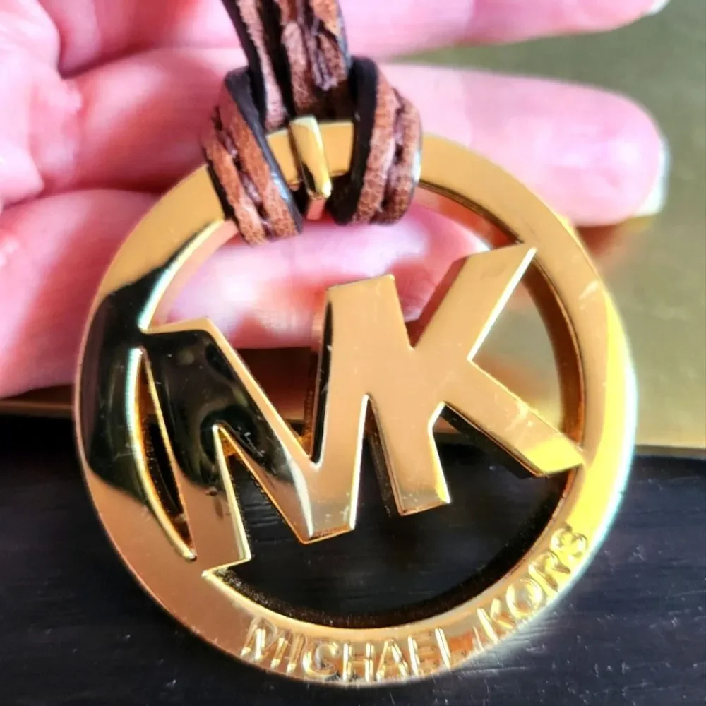 Michael Kors Gold Logo Pendant with Brown Cord